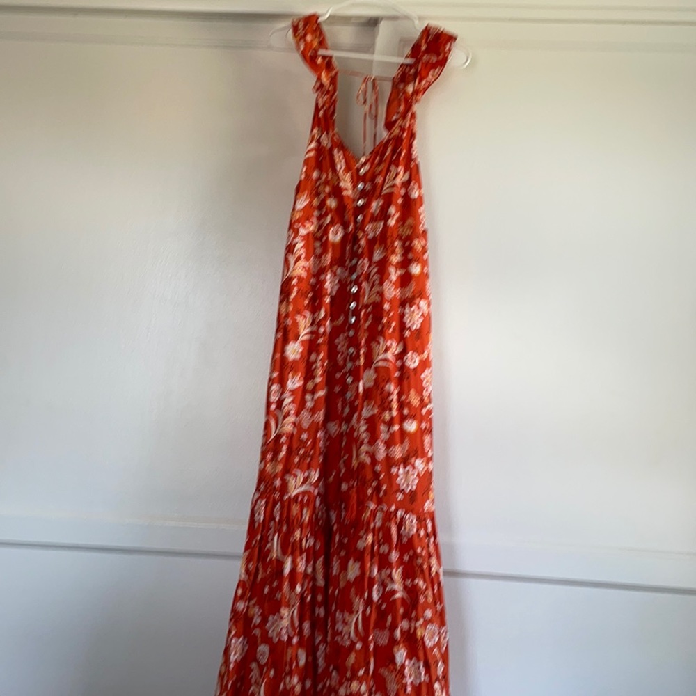 Orange maxi dress. Not branded. Frilly sleeves . Button up front and tassels